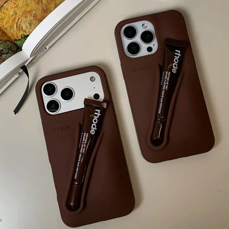 Two Rhode brown phone cases with 'rhode' branding on a light surface.
