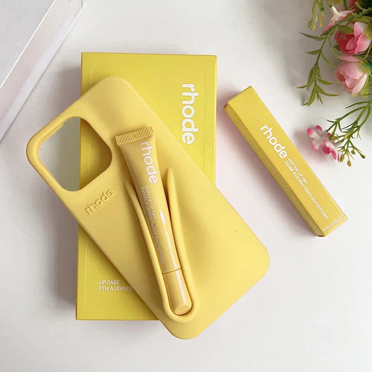 Yellow Rhode lip care products with 'rhode' branding on a white background