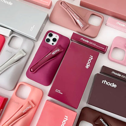 Collection of phone cases and accessories with 'rhode' branding on a white background