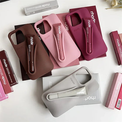 Collection of Rhode phone cases and accessories on a white surface