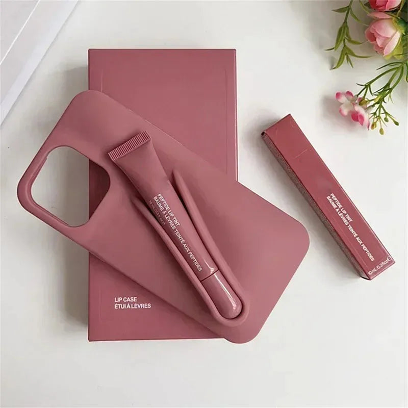 Pink lip case with lip balm on a white surface with flowers