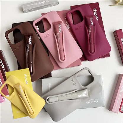 Collection of phone cases and accessories with 'rhode' branding on a white background