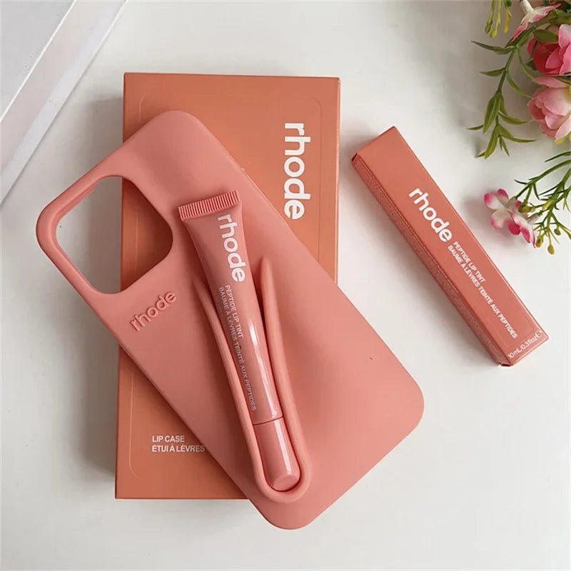 Pink Rhode lip case and lip balm with 'rhode' branding on a white background