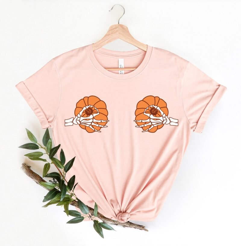 Halloween style with our 'Jack The Skeleton Pumpkin Shirt.' A funny and fashionable Women's Skeleton Shirt for spooky yet playful vibes.