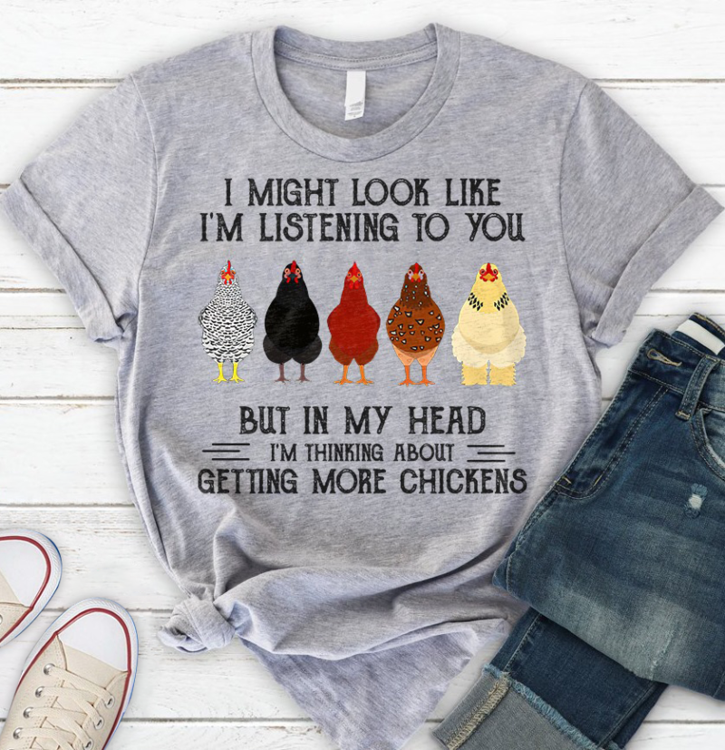 The funny chicken shirt "I Might Look Like I'm Listening To You But In My Head I'm Thinking About Getting More Chicken Shirt" is a humorous and relatable garment for chicken enthusiasts. This shirt playfully conveys the wearer's passion for chickens with a touch of wit.