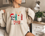 Custom Gigi Claus Sweatshirt - Festive Christmas gift for Grandma featuring a heartwarming design of Gigi Claus and her grandkids.